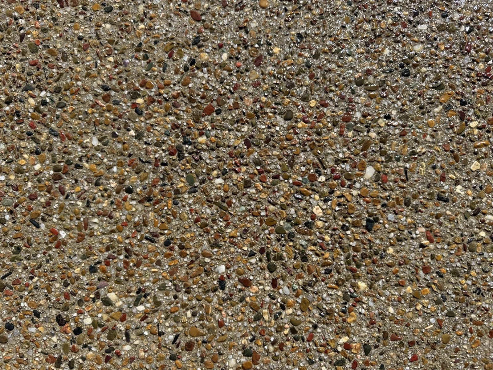 Close-up of a washed exposed aggregate finish showing the pebble colours
