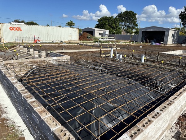 Reinforcing mesh tied over membrane inside slab formwork