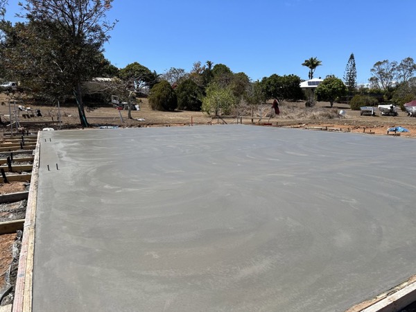 A large freshly floated concrete slab drying in the sun